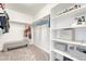 Organized walk-in closet featuring ample shelving and hanging space for storage and organization at 1066 S Eaton Park Ct, Aurora, CO 80018