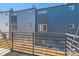 View from balcony overlooking modern townhome exteriors with sleek metal siding and large windows at 5530 W 11Th Pl, Lakewood, CO 80214