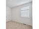 Neutral bedroom featuring a window for natural light and carpeted floors at 6501 14Th St, Frederick, CO 80530