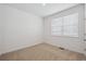 Neutral bedroom featuring a window for natural light and carpeted floors at 6501 14Th St, Frederick, CO 80530