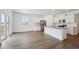 Bright kitchen featuring white cabinets, stainless steel appliances, and a large island at 6501 14Th St, Frederick, CO 80530