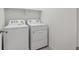 Laundry room with a white washer and dryer at 6501 14Th St, Frederick, CO 80530