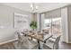 Bright dining room features a table with chairs and sliding glass door to deck at 3274 Belleville Ridge Rd, Elizabeth, CO 80107