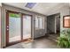 Bright entryway featuring tile floors, frosted glass door, and stairs leading to the upper level at 6303 W Exposition Ave, Lakewood, CO 80226
