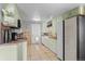Eat-in kitchen features ample cabinets and neutral tile floors at 6303 W Exposition Ave, Lakewood, CO 80226
