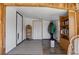 Cozy sunroom with wood accents, comfortable seating, and bookshelves, bathed in natural light at 6303 W Exposition Ave, Lakewood, CO 80226