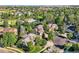 Aerial view of a neighborhood featuring well-maintained homes and mature trees at 13891 Muirfield Ct, Broomfield, CO 80023