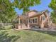 Charming backyard featuring a patio, pergola, and nicely manicured lawn at 13891 Muirfield Ct, Broomfield, CO 80023