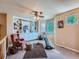 Bright bonus room featuring custom built-ins, a ceiling fan, and ample natural light at 13891 Muirfield Ct, Broomfield, CO 80023