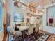 Elegant dining room with an upper level view, chandelier lighting and hardwood floors at 13891 Muirfield Ct, Broomfield, CO 80023