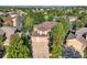 Aerial shot showcasing a house with a three-car garage, surrounded by trees and greenery at 13891 Muirfield Ct, Broomfield, CO 80023