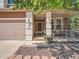 Inviting front porch with charming details and lovely landscaping, perfect for relaxing at 13891 Muirfield Ct, Broomfield, CO 80023
