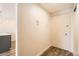 Hallway with wood-look flooring, connecting to a modern kitchen area at 1302 S Parker Rd # 229, Denver, CO 80231