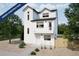 New construction two-story home featuring white siding, a small porch, and a xeriscaped front yard at 46537 Avery Ln, Bennett, CO 80102