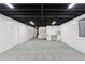 Spacious unfinished basement featuring black ceiling, white walls and an office nook at 7500 E Dartmouth Ave # 8, Denver, CO 80231