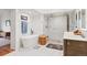Luxurious bathroom featuring a freestanding tub, a glass shower and double sink at 7500 E Dartmouth Ave # 8, Denver, CO 80231