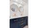Stylish bathroom featuring double vanity with modern fixtures and octagon decorative mirrors at 7500 E Dartmouth Ave # 8, Denver, CO 80231