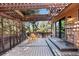 Relax on this large deck with wood pergola, chairs, and easy access to backyard at 7500 E Dartmouth Ave # 8, Denver, CO 80231