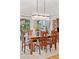 Dining room features wood table, modern chandelier, and a hutch at 7500 E Dartmouth Ave # 8, Denver, CO 80231