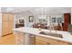 Bright kitchen island with stainless dishwasher and sink, adjacent to dining area at 7500 E Dartmouth Ave # 8, Denver, CO 80231