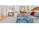 Comfortable bedroom featuring a hardwood floor, a neutral carpet, and stylish decor at 7500 E Dartmouth Ave # 8, Denver, CO 80231