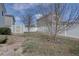 View of the backyard with storage shed and stone path at 18997 E 51St Pl, Denver, CO 80249