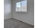 Empty bedroom provides a blank canvas with soft carpeting and natural light at 18997 E 51St Pl, Denver, CO 80249