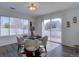 Bright dining area featuring a modern table set, hardwood floors and natural light at 18997 E 51St Pl, Denver, CO 80249
