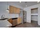 Modern kitchen featuring stainless steel appliances, tiled floors, and bright lighting at 18997 E 51St Pl, Denver, CO 80249