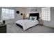 Relaxing main bedroom features a comfortable bed, soft lighting, and stylish decor at 18997 E 51St Pl, Denver, CO 80249
