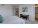 Spacious bedroom features neutral colors, an accent bench and ample closet space at 18997 E 51St Pl, Denver, CO 80249
