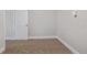 This basement features carpet, neutral paint, and a white door at 8199 Welby Rd # 501A, Denver, CO 80229