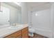 This bathroom features a vanity with a large mirror and a shower/tub combo at 8199 Welby Rd # 501A, Denver, CO 80229