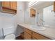 This bathroom features a vanity and a large mirror and lots of storage at 8199 Welby Rd # 501A, Denver, CO 80229