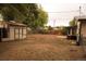 Spacious backyard featuring a storage shed and wood fence at 6213 Gray St, Arvada, CO 80003