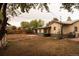 Large backyard with a combination of grass and mulch, featuring a shed and grill, ideal for outdoor projects and relaxation at 6213 Gray St, Arvada, CO 80003