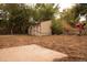 Backyard featuring a storage shed, mature trees and privacy at 6213 Gray St, Arvada, CO 80003