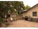 Backyard patio area with a grill and outdoor seating, plus storage shed at 6213 Gray St, Arvada, CO 80003