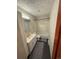 Bathroom with a vanity, sink, toilet, and shower/tub combo, plus neutral accents at 6213 Gray St, Arvada, CO 80003