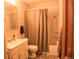 Bathroom featuring a vanity, toilet, and shower/tub combo with neutral decor at 6213 Gray St, Arvada, CO 80003