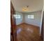 Bedroom showcasing hardwood floors, ample natural light, and neutral walls at 6213 Gray St, Arvada, CO 80003