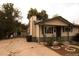 Charming single-story home with a large front yard and covered porch at 6213 Gray St, Arvada, CO 80003