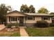 Lovely ranch home featuring great curb appeal and a spacious front yard at 6213 Gray St, Arvada, CO 80003