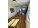 Bright living room with beautiful hardwood floors and lots of natural light at 6213 Gray St, Arvada, CO 80003
