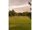 A community open area with a playground in the distance at 6213 Gray St, Arvada, CO 80003