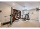 Finished basement featuring workout equipment and built in bookshelf, a perfect space for fitness and reading at 11070 Meade Ct, Westminster, CO 80031