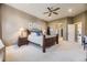 Primary bedroom with ensuite bathroom, carpet flooring, ceiling fan, and views to the Primary bath at 11070 Meade Ct, Westminster, CO 80031