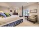 Comfortable bedroom with a four-poster bed, neutral walls, and a large window for natural light at 11070 Meade Ct, Westminster, CO 80031