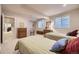 Bright bedroom with twin beds, wood furniture, and a calm, cozy atmosphere for a great night's sleep at 11070 Meade Ct, Westminster, CO 80031