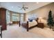 Primary bedroom with bay windows, a ceiling fan, and a king-sized bed at 11070 Meade Ct, Westminster, CO 80031